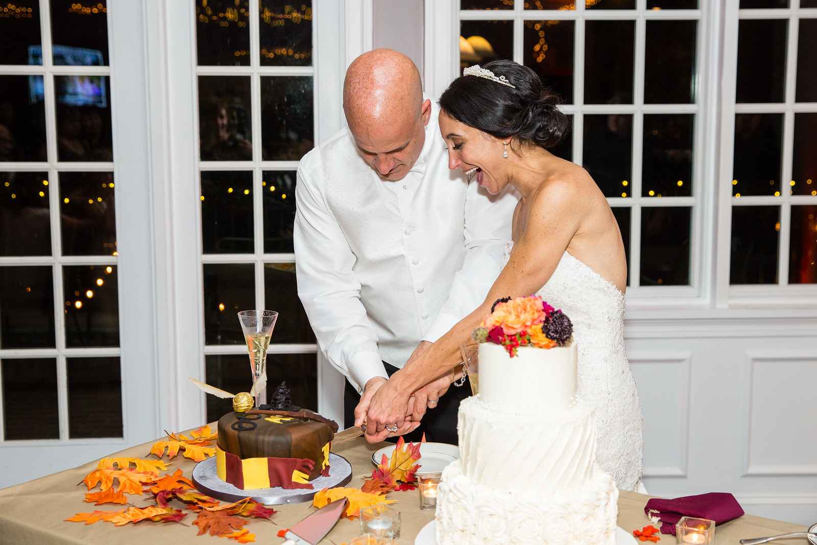 bride and groom cutting wedding cake fall weddings by perfect planning events