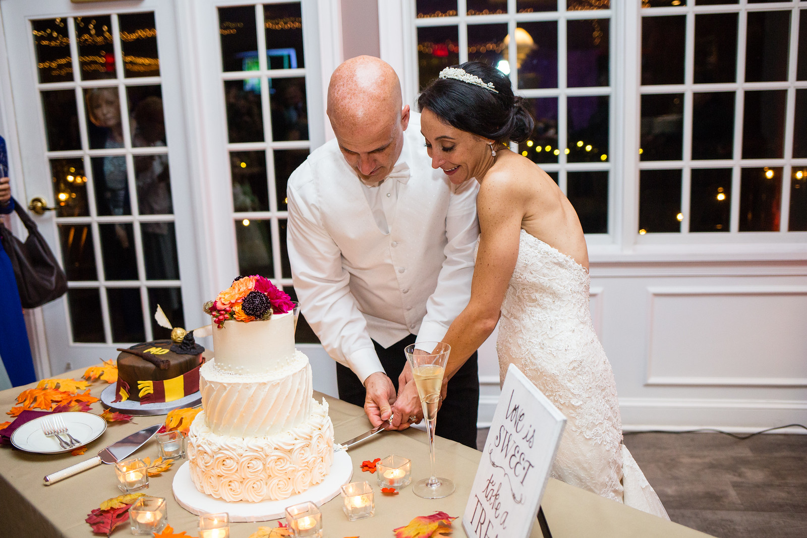 cutting of wedding cake by perfect planning events