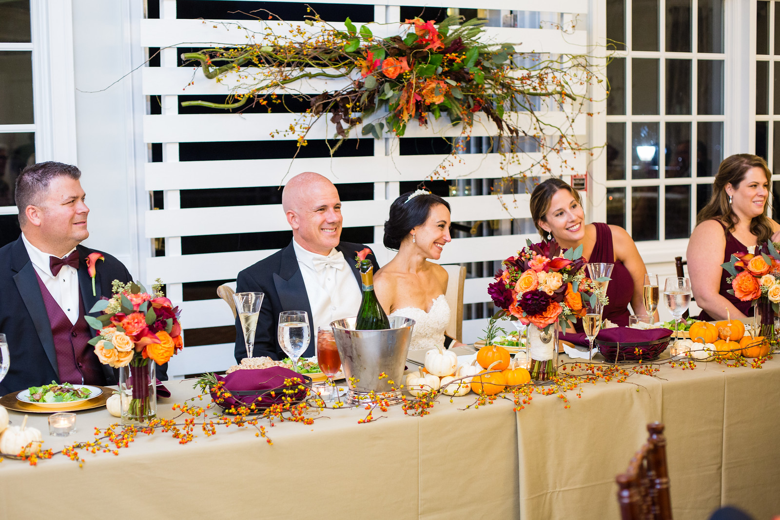 bride and groom at headtable fall weddings by perfect planning events