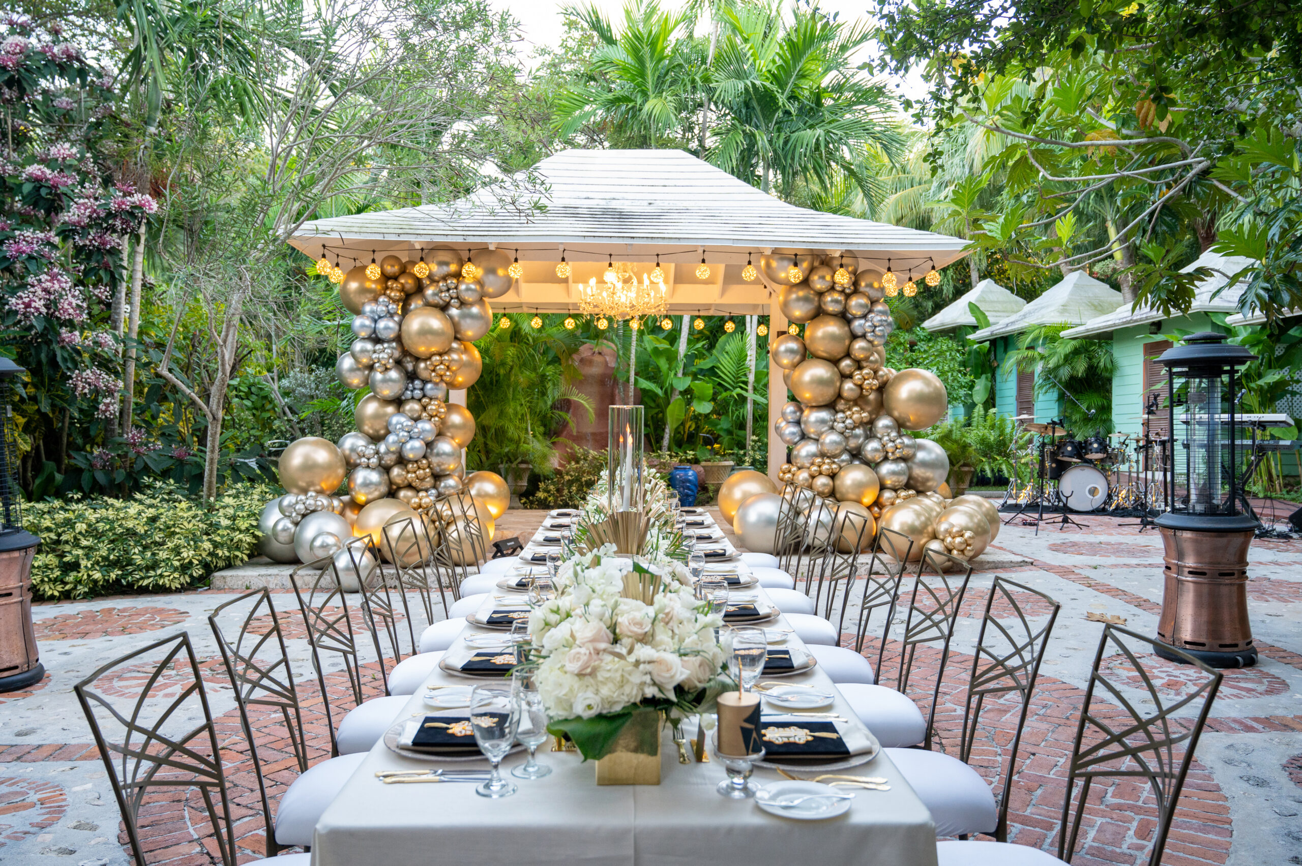 An elegant guest table and gazebo for a birthday party designed by a top event planner in Washington DC.